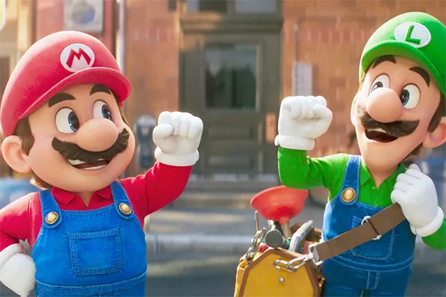 still of mario and luigi from the super mario bros movie mid-fist bump