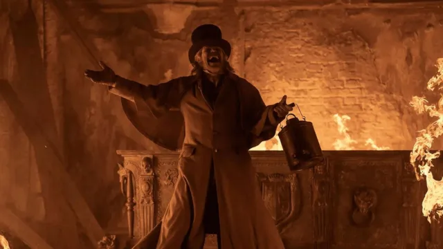 willem dafoe in nosferatu 2024 laughing as fire engulfs a coffin