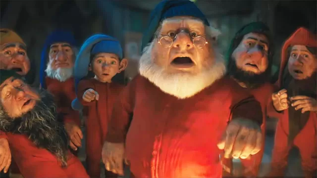 Doc. andthe rest of the seven dwarves from snow white standing around in their pajamas and looking frightened