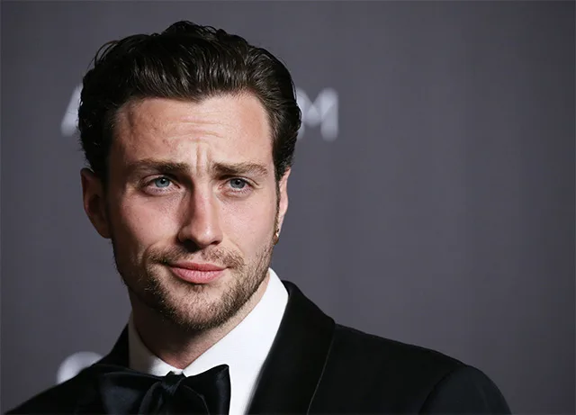 aaron taylor-johnson wearing bond like tuxedo