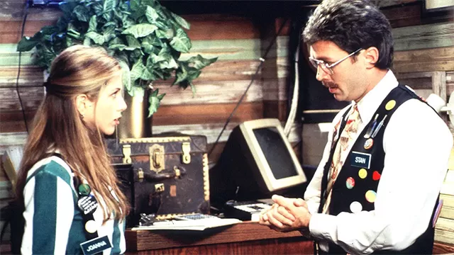jennifer anniston and mike judge in office space talking about her doing the bare minimum with her flare as an illustration of wokeness in Superman casting choices
