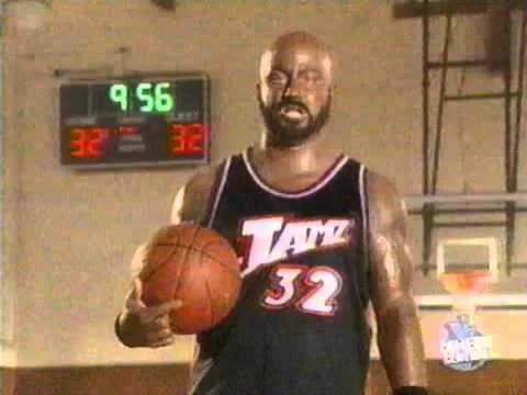 jimmy kimmel in black makeup and basketball jersey dressed up as karl malone for the man show