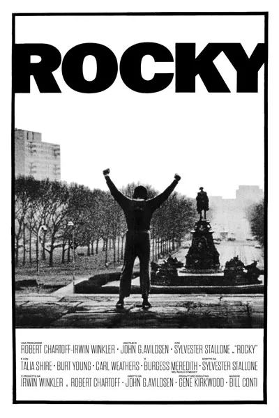 Rocky 1976 poster: Sylvester Stallone arms raised on Philadelphia steps iconic black and white classic boxing movie poster underdog story – conservative alternative to Rotten Tomatoes anti-woke WOKE-O-METER rating & Christian family-friendly verdict exposing woke Hollywood agenda on WorthItOrWoke.com