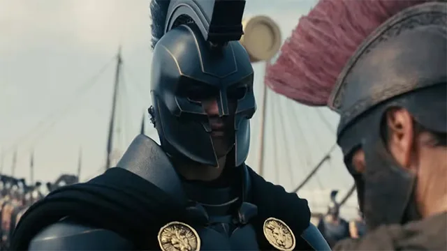 Agamemnon in dark Greek armor and helmet from the 2026 movie The Odyssey – powerful Mycenaean king scene – conservative alternative to Rotten Tomatoes anti-woke WOKE-O-METER rating & Christian family-friendly verdict exposing woke Hollywood agenda on WorthItOrWoke.com